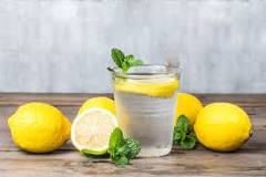 What are the benefits of drinking lemon water on an empty stomach?
