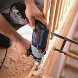 What is the function of a hammer drill?